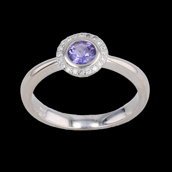 White gold ring with blue synthetic stone and diamonds