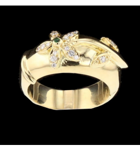 Anello articolata fiore oro diamanti gialli e smeraldo.